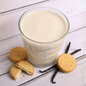 Creamy cookie shake from AmBari Nutrition with cookies and cream flavor in a glass, topped with whipped cream and cookie crumbles.