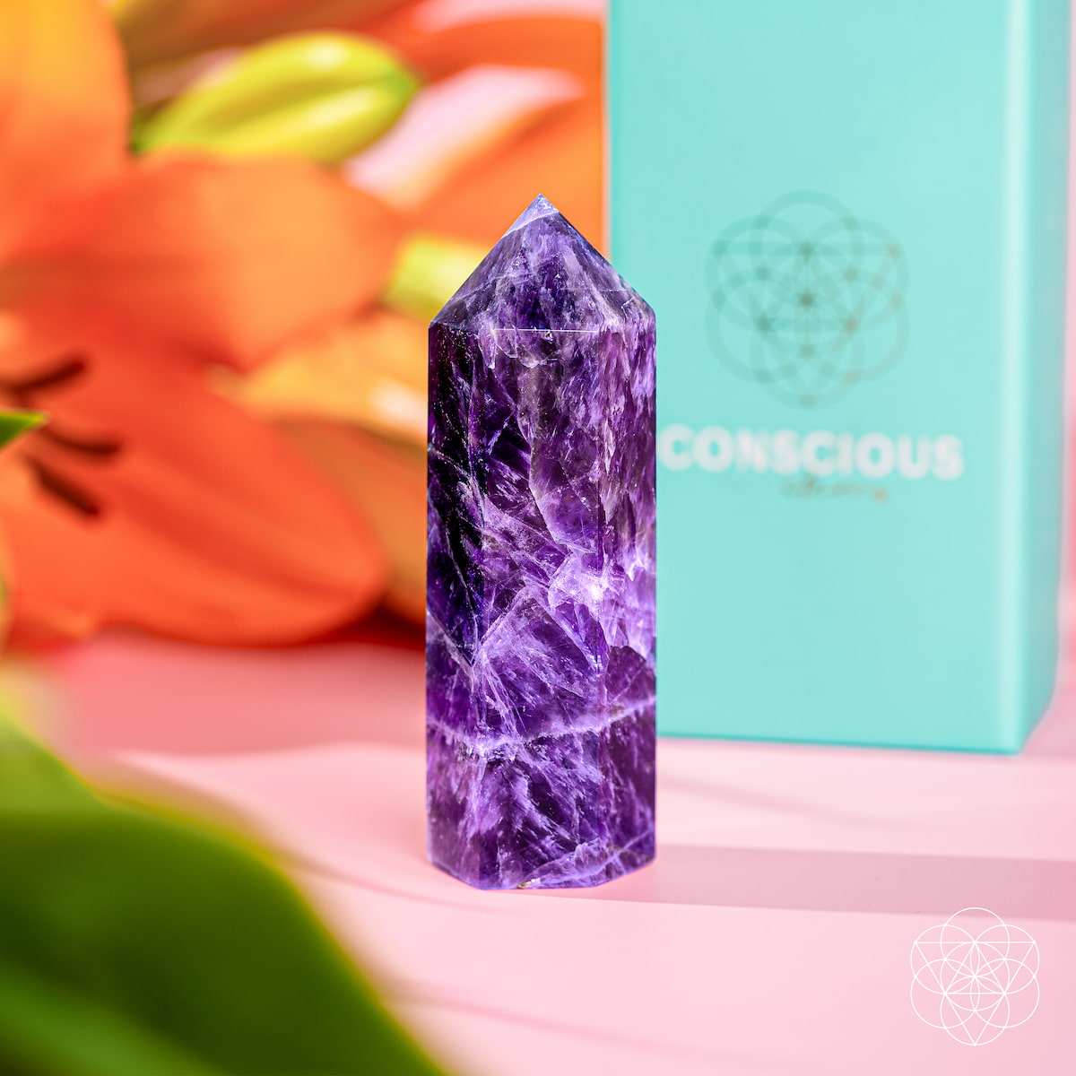 Chevron Amethyst Point of Transformation from Conscious Items, a home decorative crystal with purple and white banding.