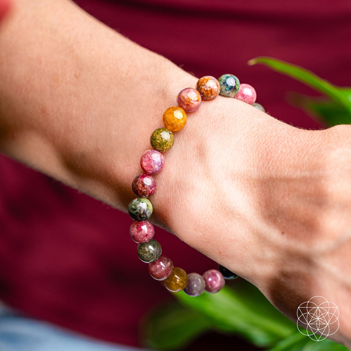 Rainbow Tourmaline bracelet called The Spiral Breaker by Conscious Items featuring colorful, polished gemstone beads on a stretch band.