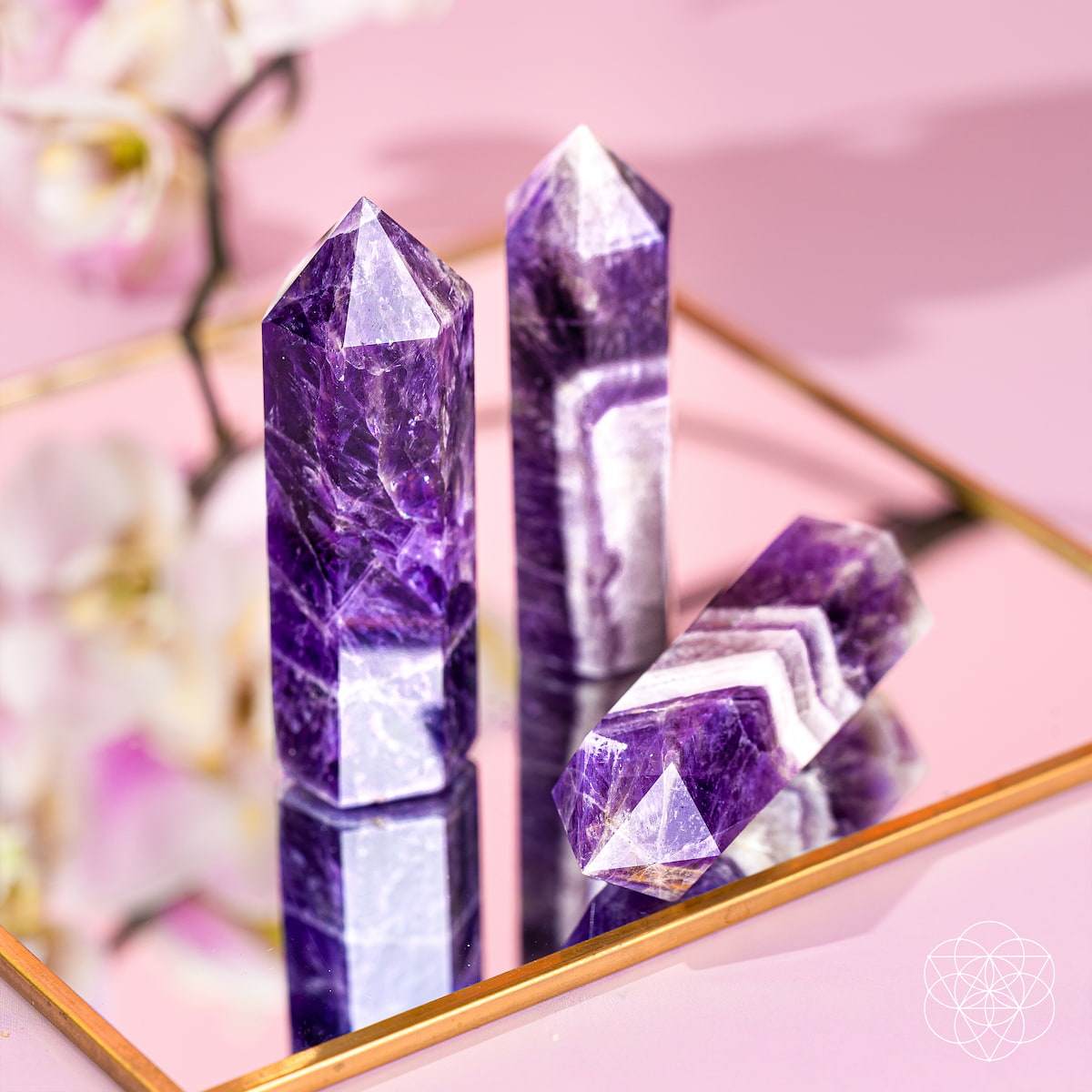 Chevron Amethyst point of transformation from Conscious Items, a crystal home decoration featuring a purple and white striped stone.