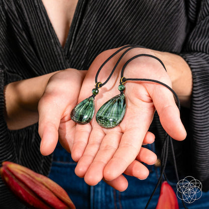 Seraphinite necklace titled The Angel By My Side by Conscious Items featuring a polished seraphinite pendant on a silver chain.
