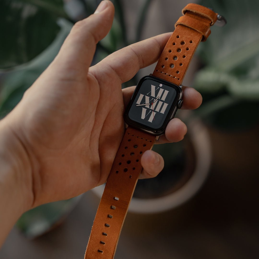 Robust racing leather strap with detailed stitching and sturdy buckle, designed for watch or accessory attachment.