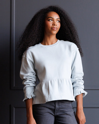 Downeast country peplum crew top, cream-colored blouse with a fitted waist and short sleeves, casual and stylish for everyday wear.