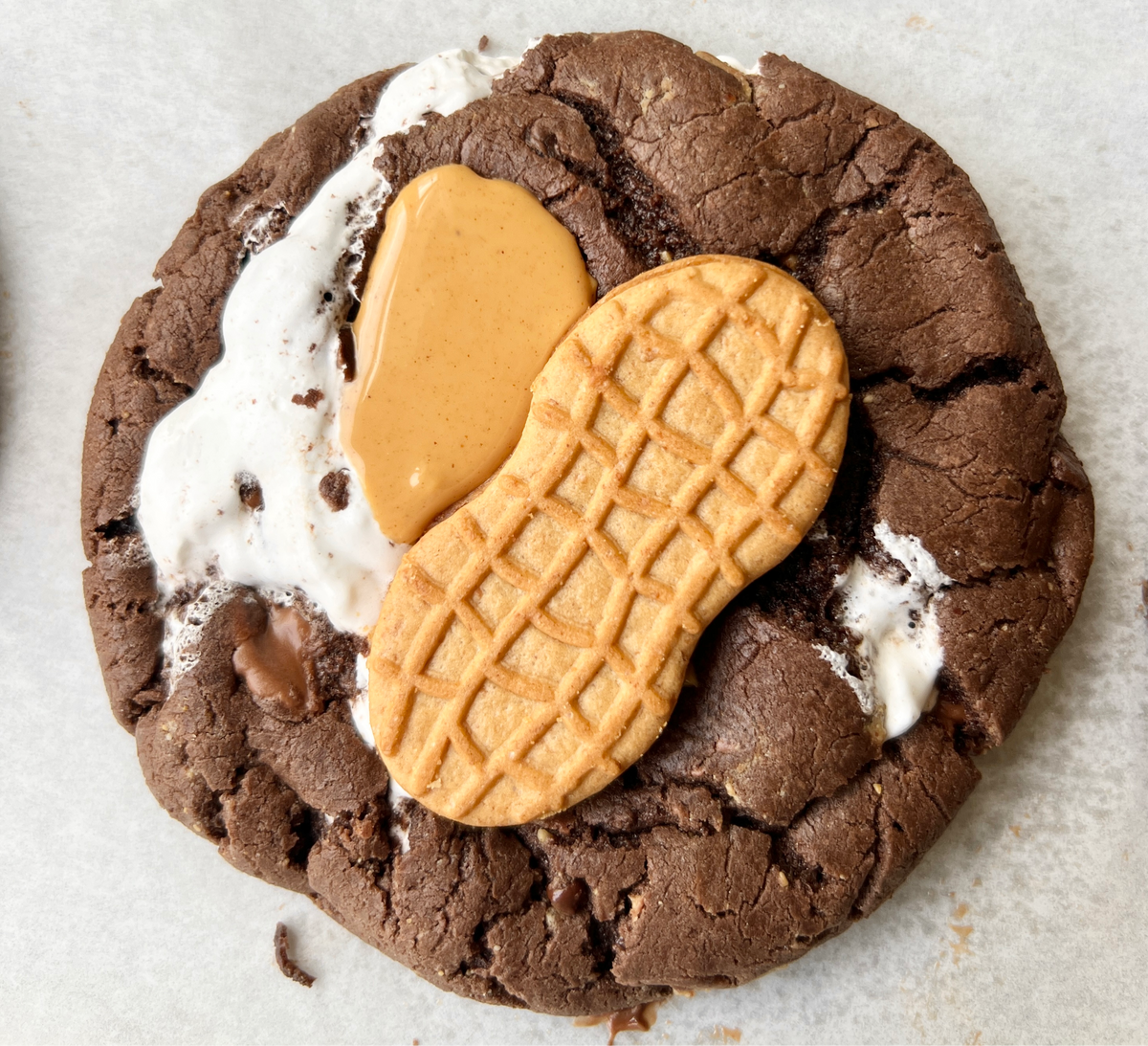 Let's Get Baked Artisan Desserts FlufferNutter Brownie, a rich and fudgy cake with peanut butter and marshmallow topping.