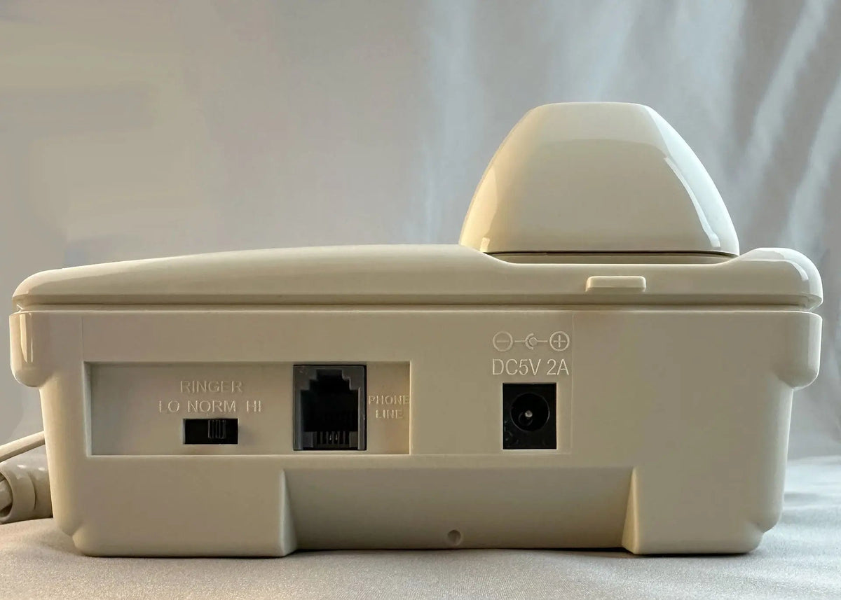 Cream-colored D520U landline console phone by MedPat Solutions with top USB-A and USB-C charging ports and full feature controls.