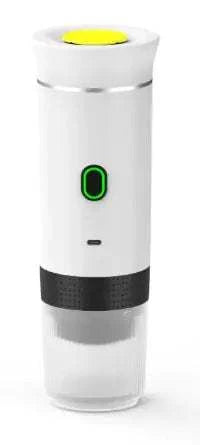 White electric portable coffee machine with green power button and black base for espresso brewing.