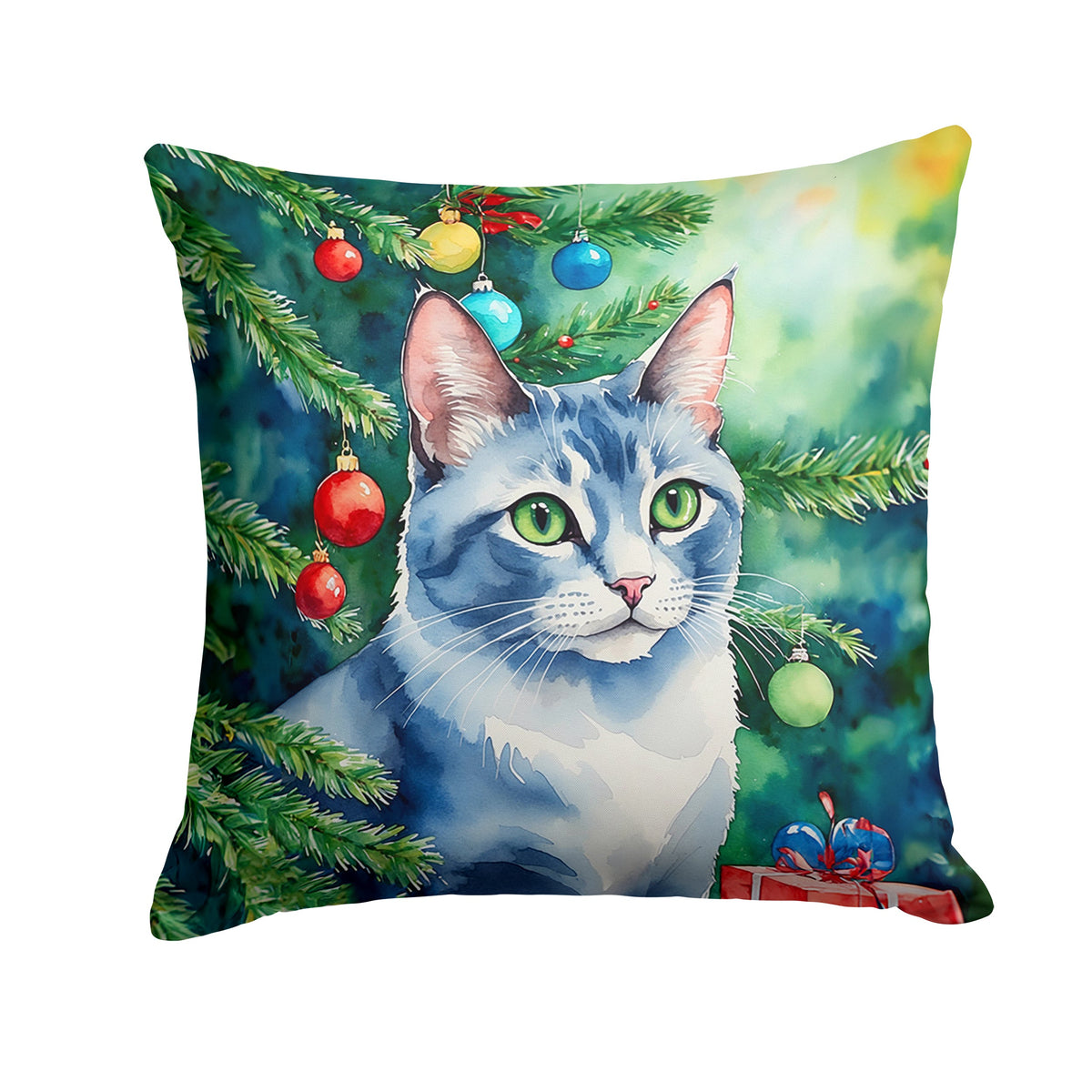 Decorative pillow featuring an Ojos Azules cat by a Christmas tree, from Caroline's Treasures, on a festive holiday setting.