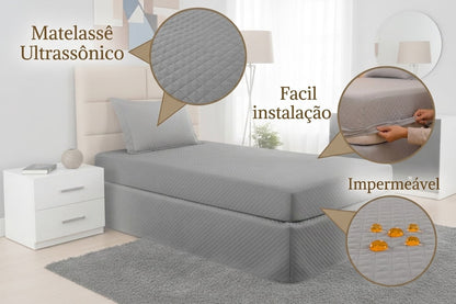 Gray Maison Charlo waterproof quilted single mattress protector on a bed, made of soft bedding fabric.