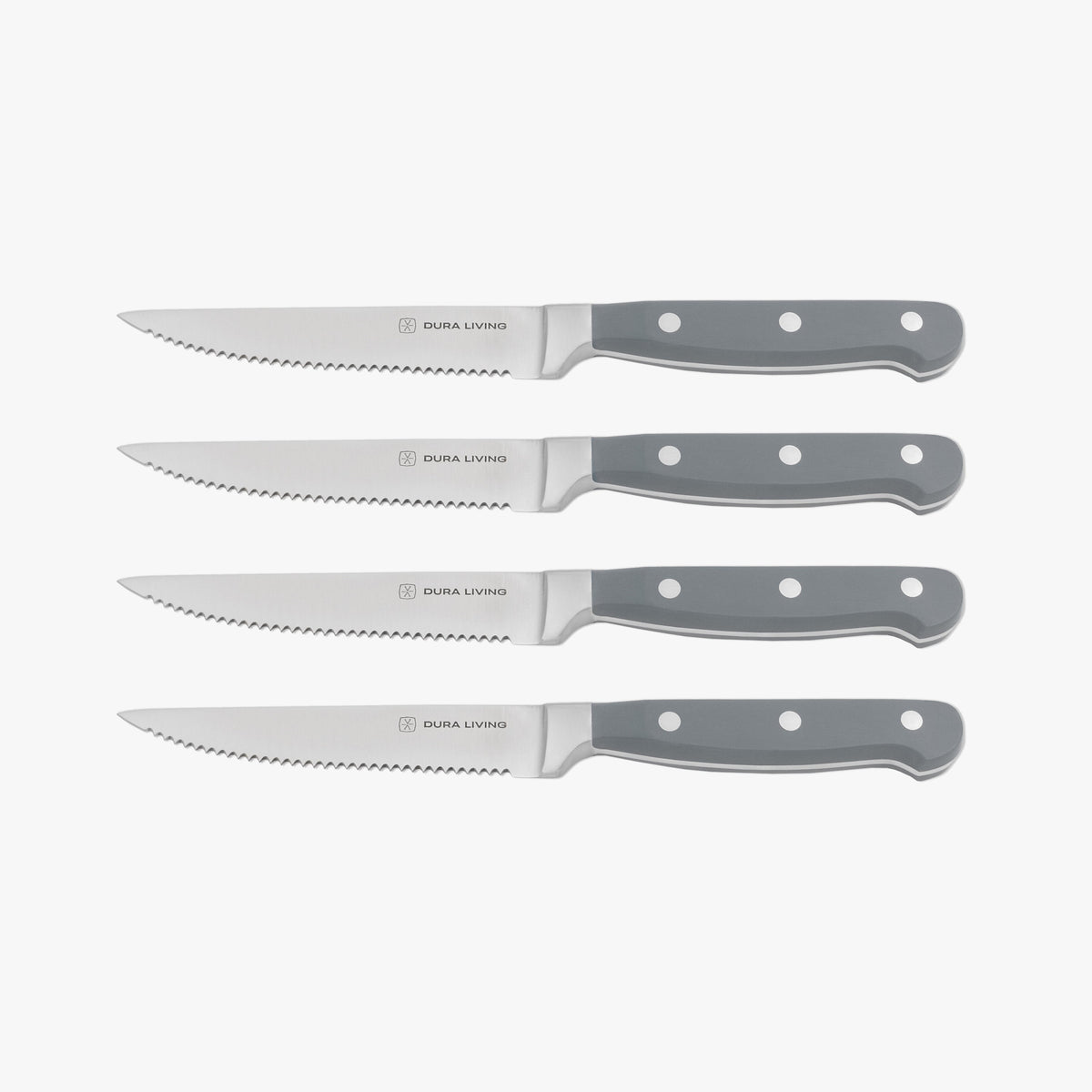 Set of four gray Dura Living steak knives with stainless steel blades, arranged on a wooden table for dining.