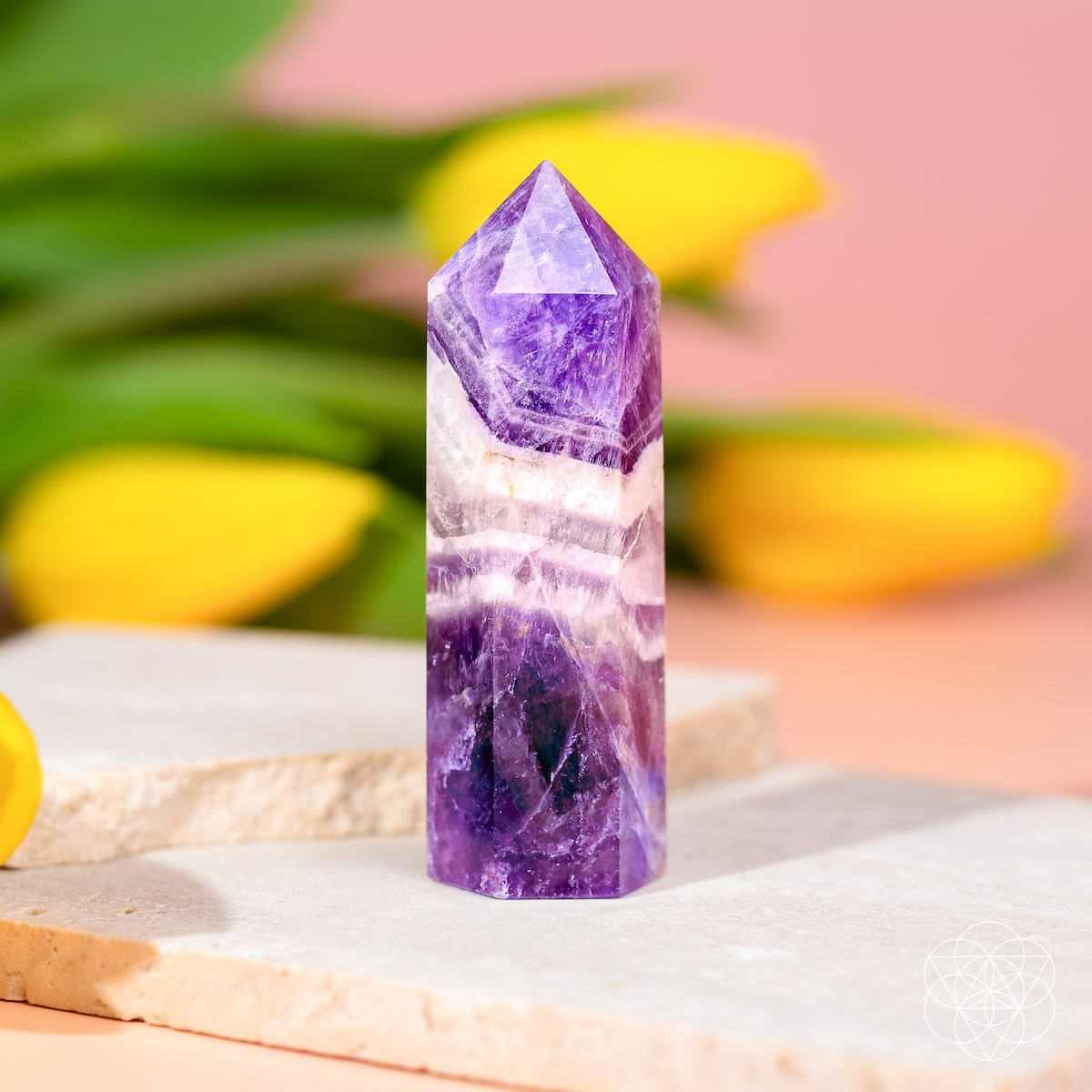 Chevron Amethyst Point of Transformation home decor crystal by Conscious Items, featuring a polished purple and white gemstone.