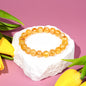 Golden Healer Quartz bracelet by Conscious Items featuring polished golden stones on a delicate string.