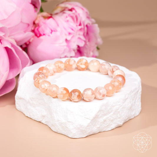 Sakura Flower Agate bracelet by Conscious Items featuring a delicate floral design and natural pink gemstone beads.