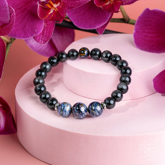 Close-up of a Namibian Pietersite bracelet by Conscious Items, featuring polished, shattered and whole stones in a striking design.