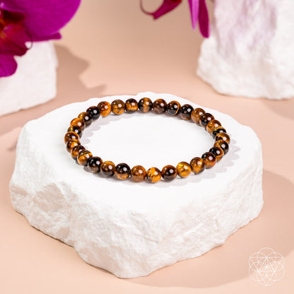 Conscious Items 7A Grade Tiger’s Eye bracelet with 6mm beads, featuring a polished, natural gemstone design.
