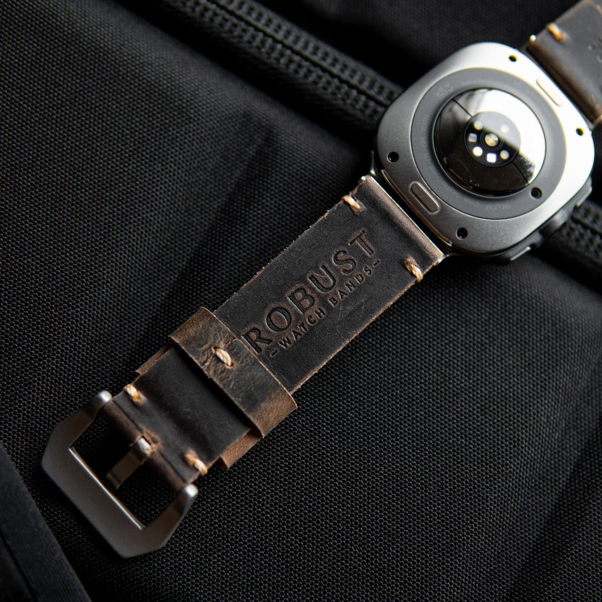 Robust Leather Strap R01 for Samsung Galaxy Watch Ultra, brown genuine leather band with stitching details on a watch face.