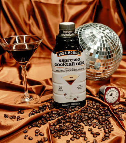 Java House Cold Brew Espresso Martini Mix bottle on a table, showcasing the product label and packaging.