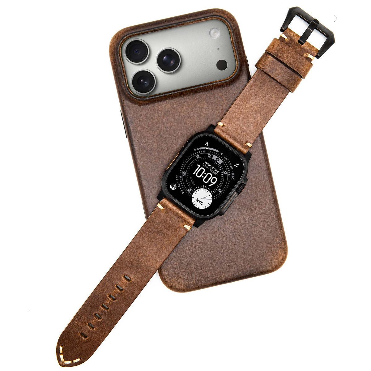 Leather case with camera cutout for a smartphone, paired with a smartwatch on a brown leather strap, all placed on a brown leather surface.