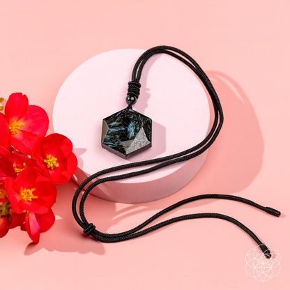 Deep healing Arfvedsonite pendant necklace by Conscious Items, featuring a polished black gemstone on a chain.