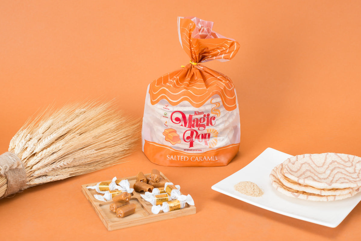 Kim's Magic Pop salted caramel flavor drizzled snack in a clear bowl, showcasing the crispy, caramel-coated popcorn.