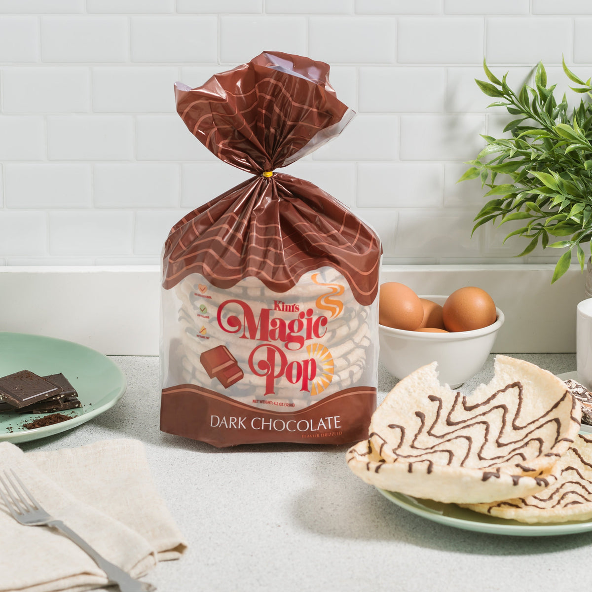 Kim's Magic Pop cinnamon swirl, salted caramel, and dark chocolate drizzled flavors in a 6 or 12 pack, Delice products, packaged for snacking.