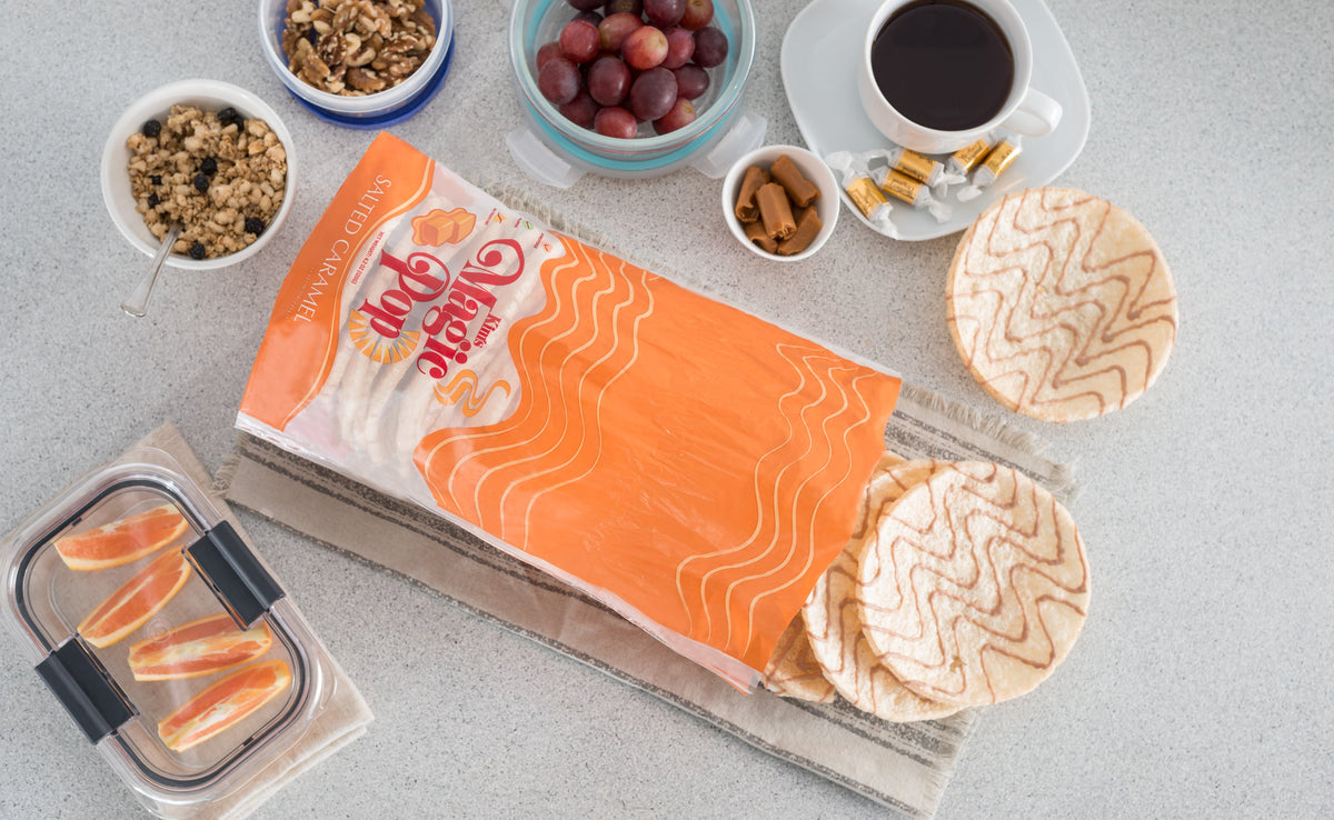 Kim's Magic Pop salted caramel and dark chocolate drizzled snack packs, 6 or 12 count, featuring caramel and chocolate flavors.