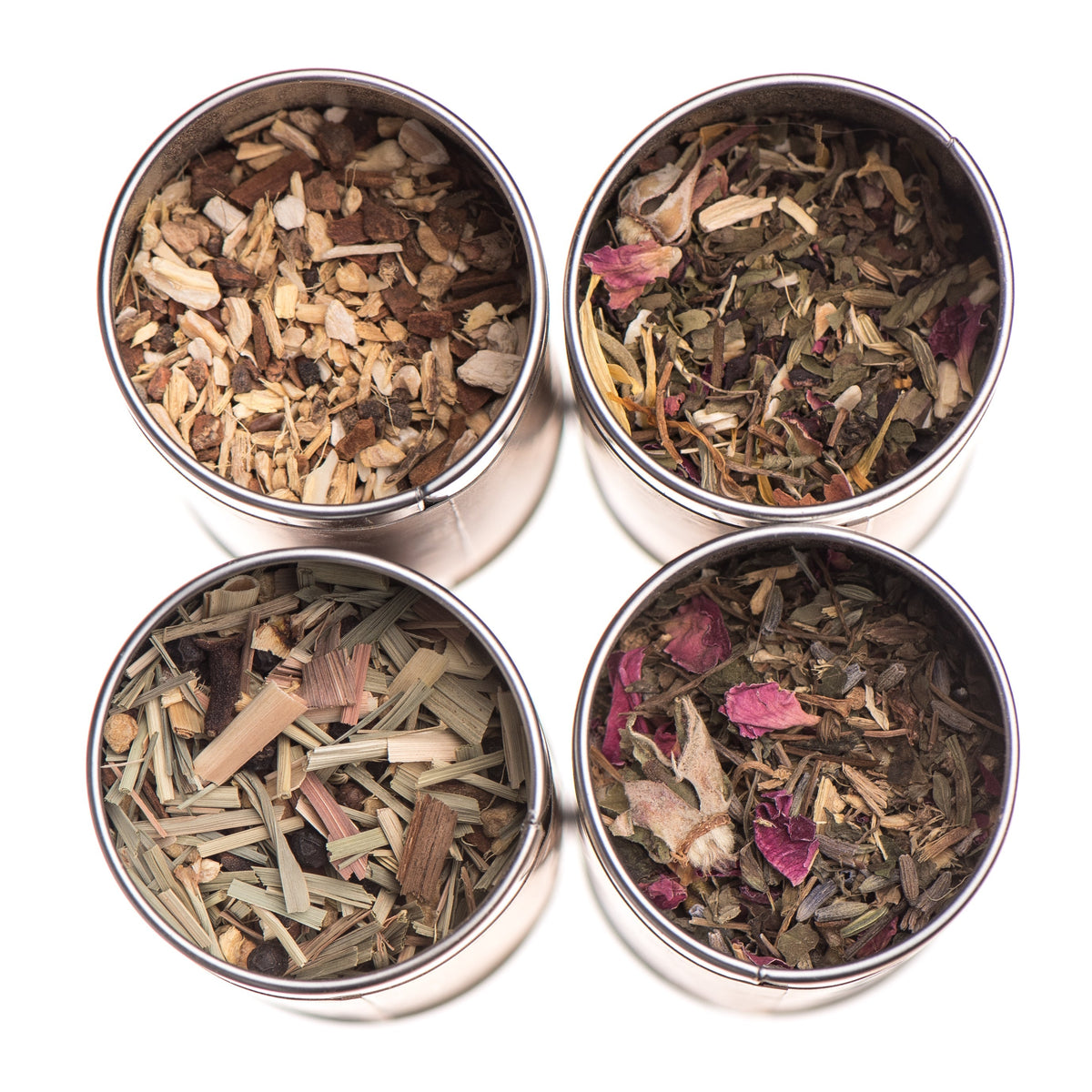 Herbal tea stack with assorted Ayurvedic teas from Paavani Ayurveda Skincare and Wellness, featuring colorful tea boxes and herbs.