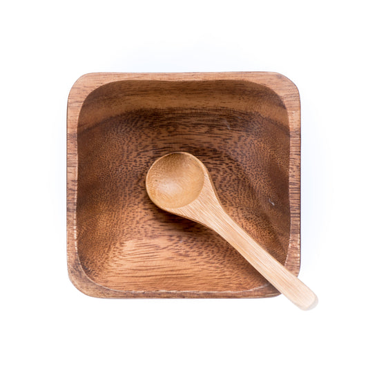 Eco-friendly facial bowl and spoon from Paavani Ayurveda Skincare for Ayurvedic skincare routines, shown on a clean surface.