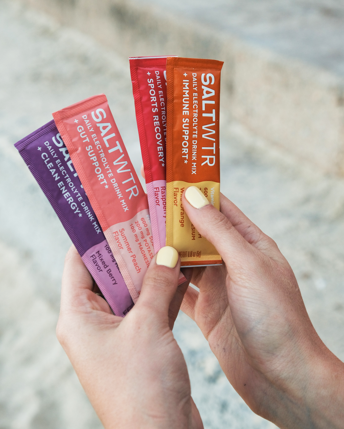 SaltWTR Variety Pack featuring different flavored saltwater drinks in colorful bottles, showcasing the product lineup.