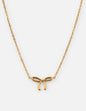 Dainty bow necklace by Elevated Faith featuring a delicate gold chain and small bow pendant.