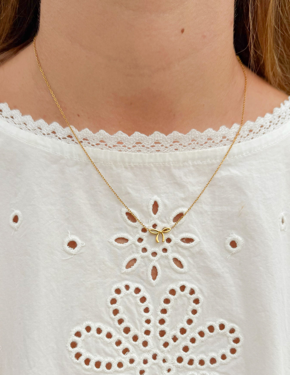 Elegant dainty bow necklace by Elevated Faith featuring a delicate design, perfect for everyday wear.