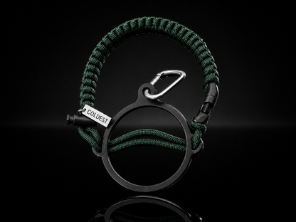 Dark green and black Coldest Paracord handle accessory with durable woven design on a dark background