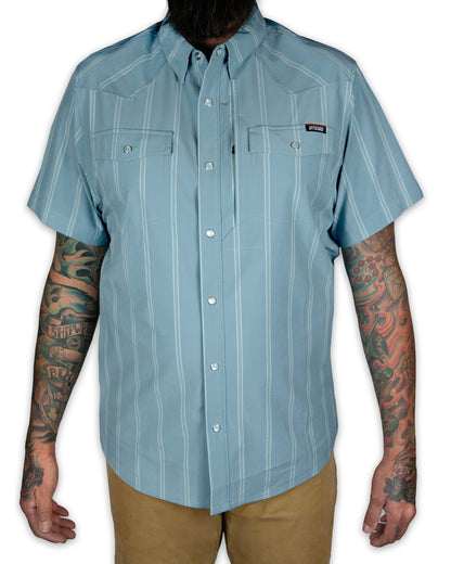 Short sleeve Daryll SS shirt in mid blue by Off The Grid Surplus, featuring a casual fit and classic collar.