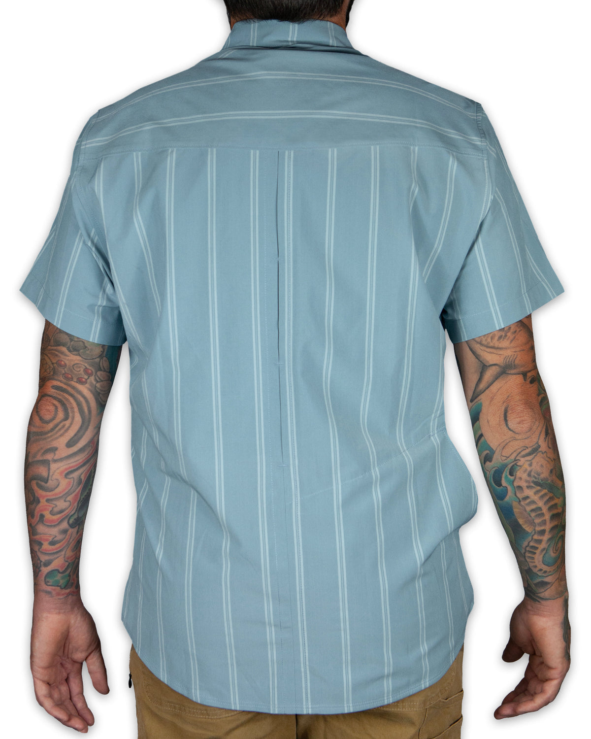 Mid blue short sleeve shirt from Off The Grid Surplus with a casual fit and classic collar, shown on a hanger.