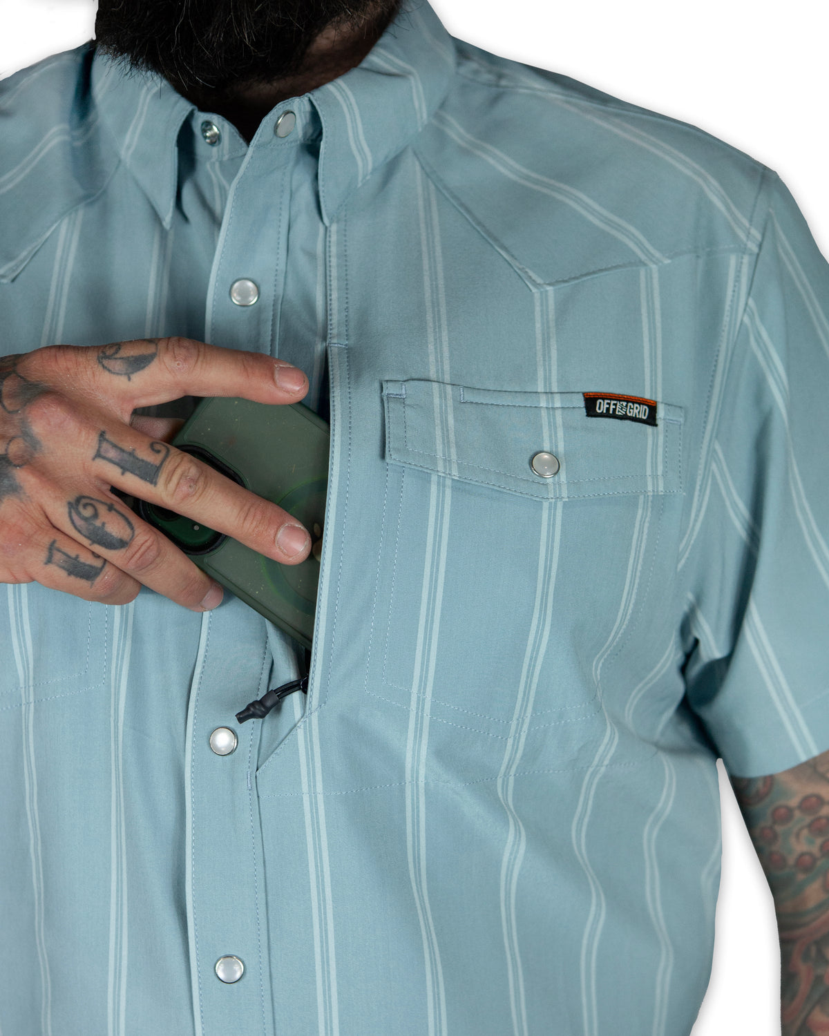 Mid blue short sleeve shirt from Off The Grid Surplus Daryll SS Shirt, displayed flat with collar and button details.
