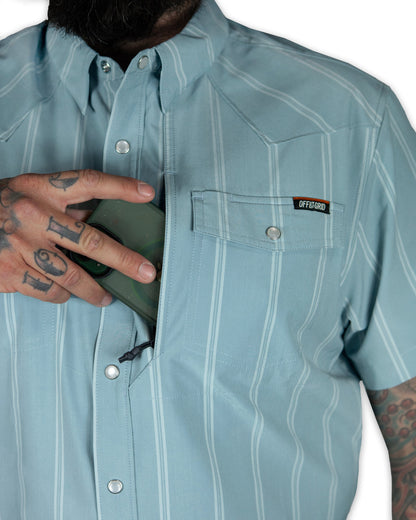 Mid blue short sleeve shirt from Off The Grid Surplus Daryll SS Shirt, displayed flat with collar and button details.