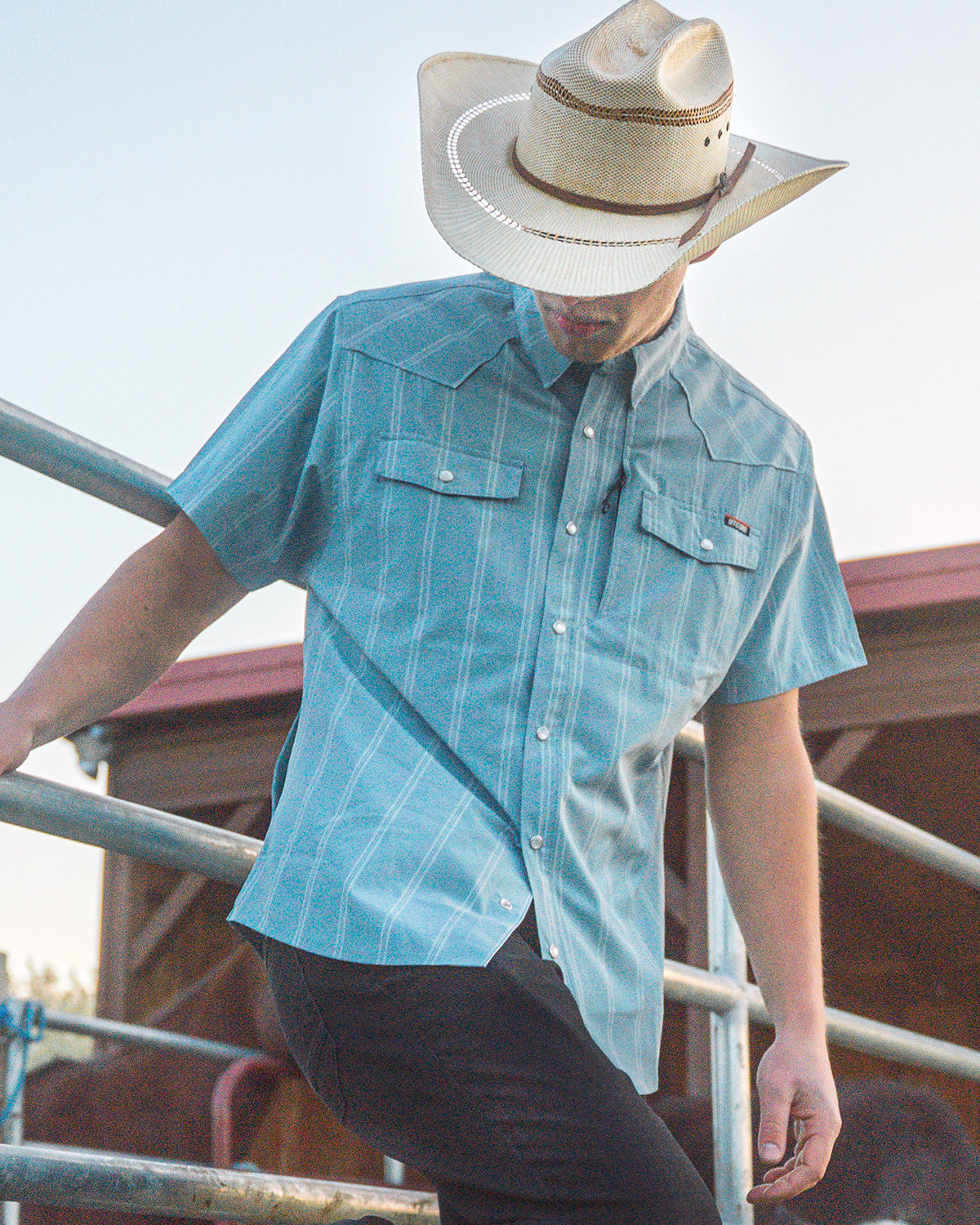 Mid blue short sleeve Daryll SS shirt by Off The Grid Surplus, shown laid flat with collar and buttons visible.