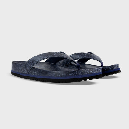 Fleks West Beach Flip Flop in deep blue sea color, showcasing a comfortable sandal with a textured strap and rubber sole.