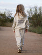 Brightly colored kids hoodie from Elevated Faith featuring "Deeply Loved" design, soft fabric, and comfortable fit for children.