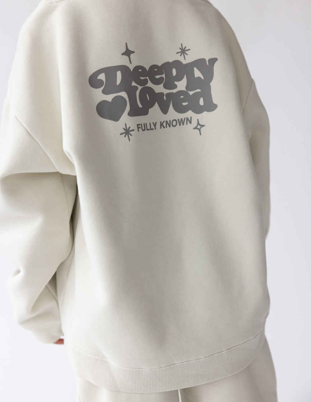 Kids hoodie from Elevated Faith featuring the "Deeply Loved" design, soft fabric, and comfortable fit for children.