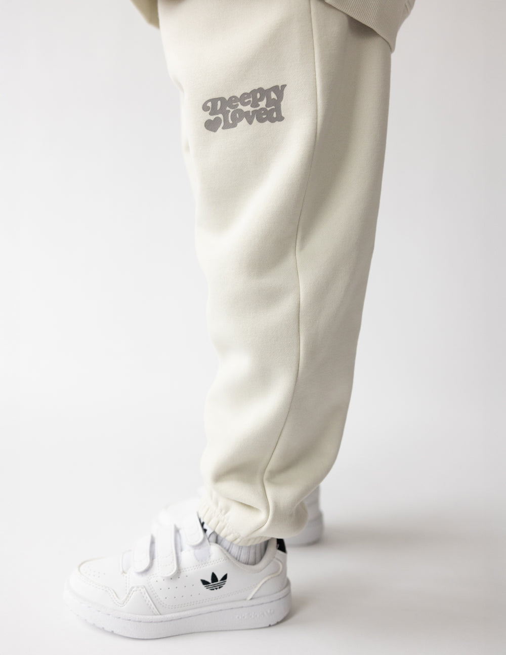 Kids' Deeply Loved Sweatpant by Elevated Faith, soft cotton fabric, in a cozy beige color, with a relaxed fit and elastic waistband.