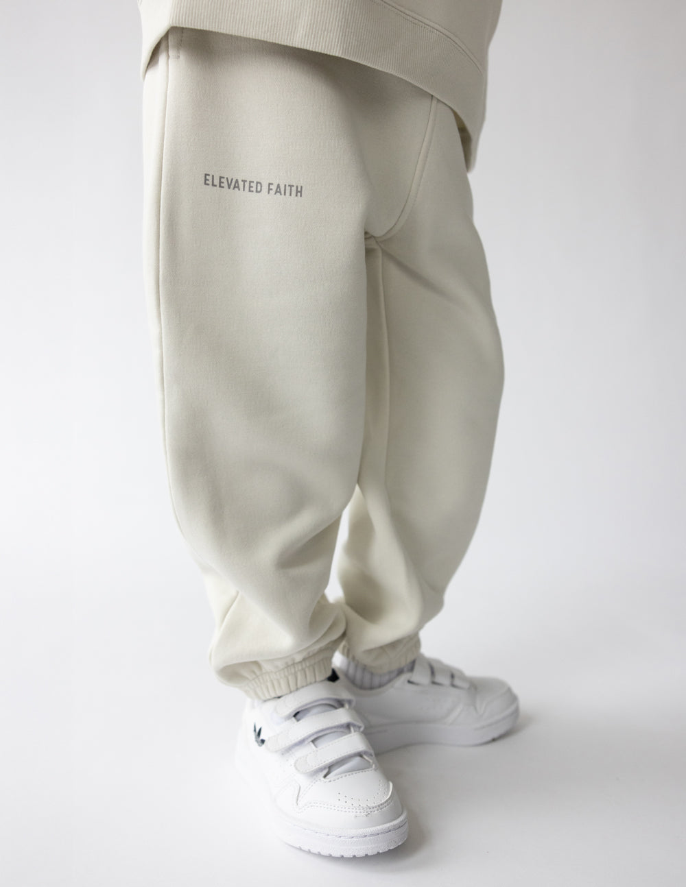 Kids sweatpant from Elevated Faith with "Deeply Loved" print, soft fabric, and comfortable fit for children.