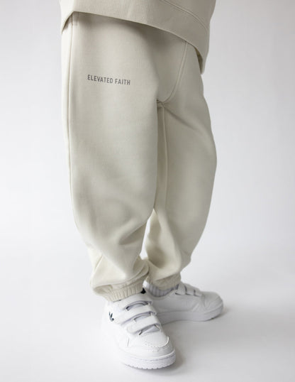 Kids sweatpant from Elevated Faith with "Deeply Loved" print, soft fabric, and comfortable fit for children.