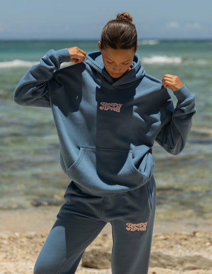 Unisex hoodie by Elevated Faith featuring a Deeply Loved design, soft fabric, and casual fit, shown in a front view.