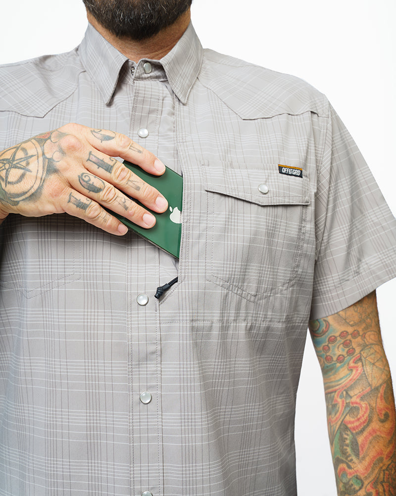 Storm grey Deke SS shirt by Off The Grid Surplus featuring short sleeves and a casual fit, displayed on a hanger.