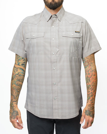 Storm grey Deke SS shirt by Off The Grid Surplus, featuring a short sleeve design and casual fit, displayed on a hanger.
