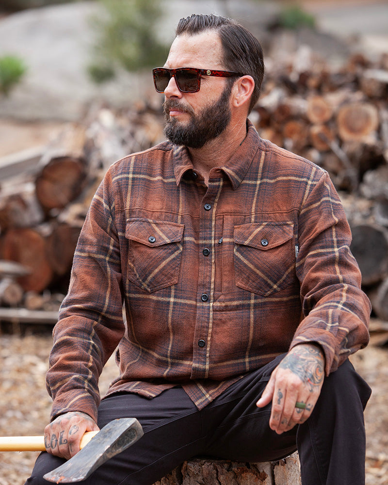 Burnt brown Destroyer Flannel by Off The Grid Surplus shown in a close-up, highlighting soft fabric and classic plaid pattern.