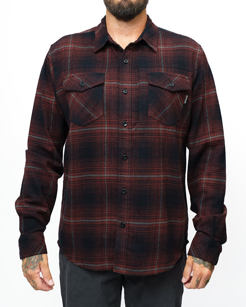 Black Destroyer Flannel by Off The Grid Surplus, showcasing a cozy, stylish black flannel shirt with button closure and classic fit.
