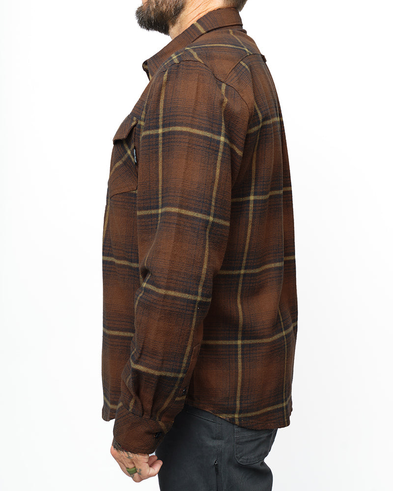 Burnt brown Off The Grid Surplus Destroyer Flannel shirt with a classic plaid pattern and button-up front.