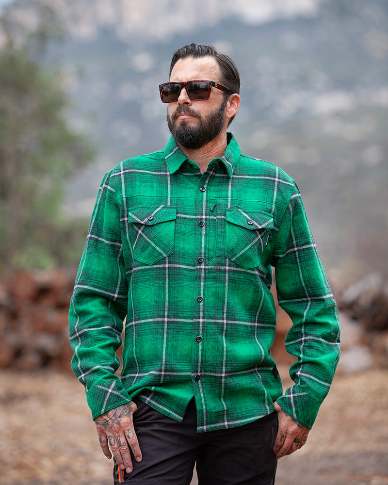 Off The Grid Surplus Destroyer Flannel in Fairway, showing a close-up of the soft, plaid fabric with a button-down collar.