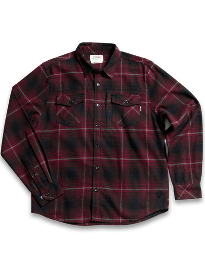 Black Destroyer Flannel shirt by Off The Grid Surplus, showing a close-up of the soft, plaid fabric and classic button details.